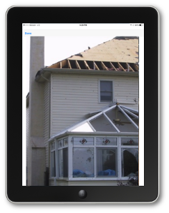 Photo of a damaged building from the Crisis Track mobile app